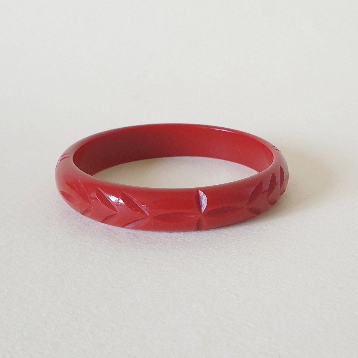 elsie-carved-fakelite-bangle-cherry-red-more-sizes-bow-crossbones-ltd-470816_1024x1024_2x_32c201fd-5e3c-45c8-acf1-1ed1547f9a33
